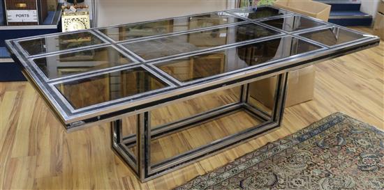 A rectangular chrome and glass dining table W.220cm